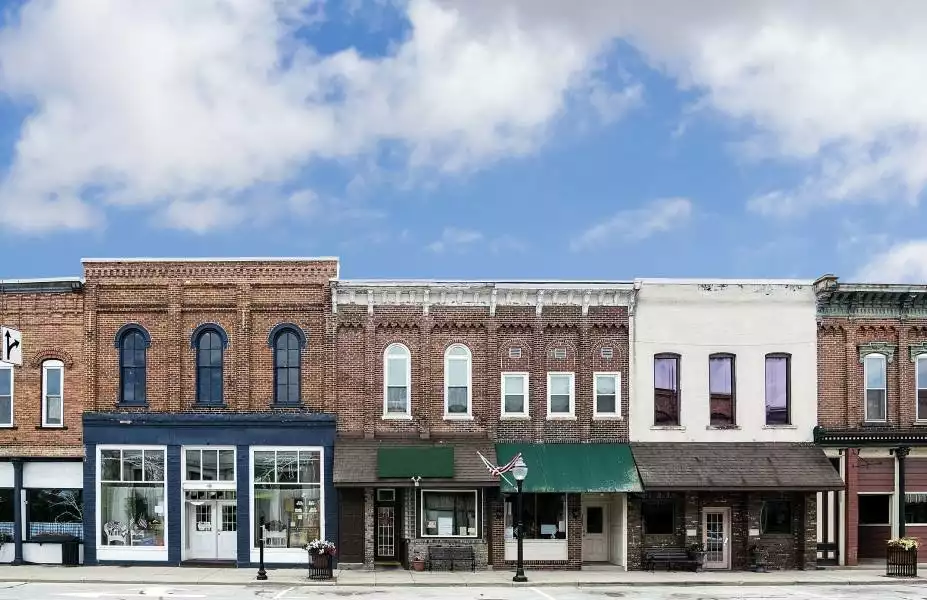 A line of brick buildings and storefronts on a small town main street