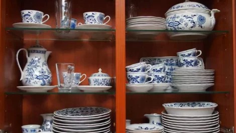 Blue and white china in a dark wood cabinet