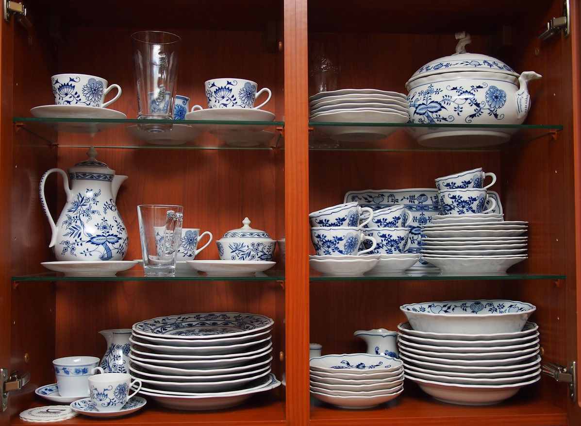 Blue and white china in a dark wood cabinet