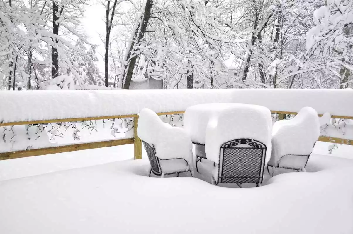 Cover protecting patio furniture from snow. 